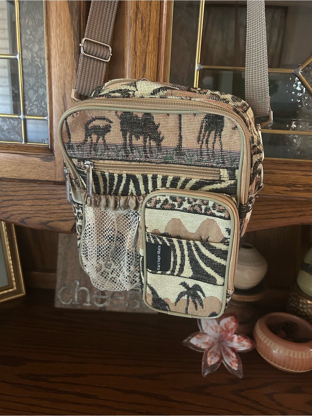 African print crossbody bag with multiple compartments and wide canvas strap